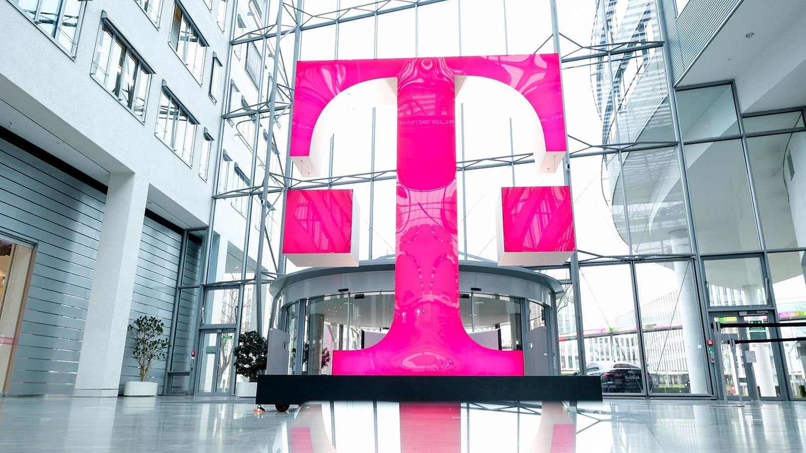 A large magenta T logo in the foyer of Deutsche Telekom's headquarters